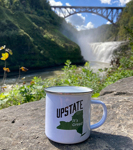 upstate new york camp mug on a rock in front of Letchworth State Park bridge